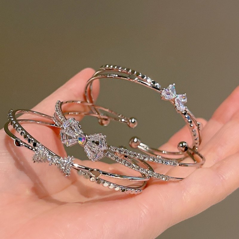 Women's Fashion Silver Niche Bow Bracelet $19.62 Dana Fashion Color: First Model Silver Women's Accessories Product information: Treatment Process: Electroplating Color: First style/silver, Second style/silver, Third style/Silver Material: Copper/zircon S