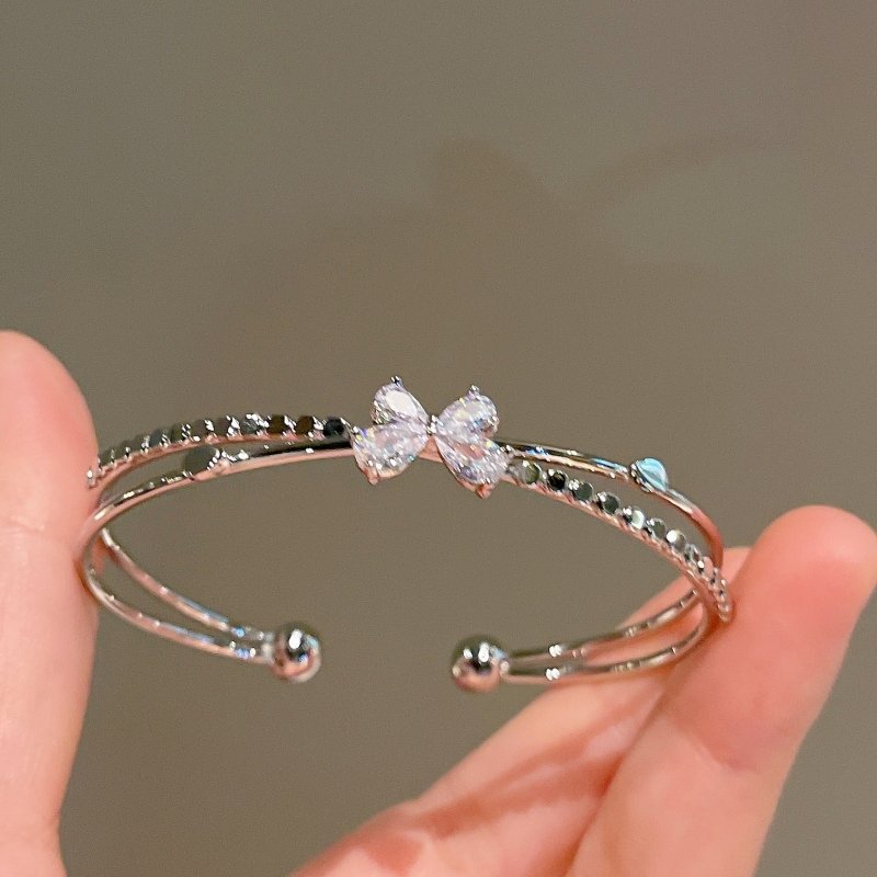 Women's Fashion Silver Niche Bow Bracelet $19.62 Dana Fashion Color: Section 3 Silver Women's Accessories Product information: Treatment Process: Electroplating Color: First style/silver, Second style/silver, Third style/Silver Material: Copper/zircon Sty