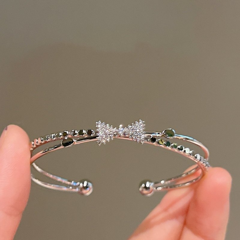 Women's Fashion Silver Niche Bow Bracelet $19.62 Dana Fashion Color: First Model Silver Women's Accessories Product information: Treatment Process: Electroplating Color: First style/silver, Second style/silver, Third style/Silver Material: Copper/zircon S