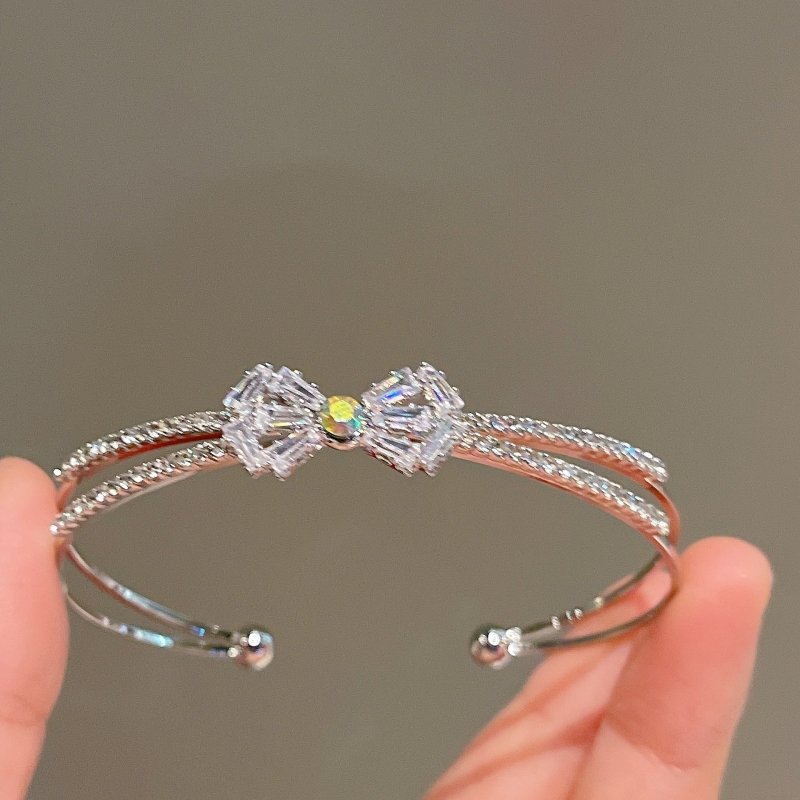 Women's Fashion Silver Niche Bow Bracelet $19.62 Dana Fashion Color: First Model Silver Women's Accessories Product information: Treatment Process: Electroplating Color: First style/silver, Second style/silver, Third style/Silver Material: Copper/zircon S