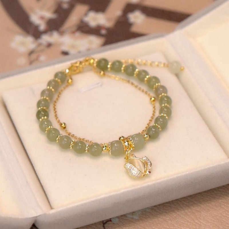 Women's Fashion Simple Tulip Double-layer Bracelet $12.60 Dana Fashion Color: Green Women's Accessories Product information: Treatment Process: Electroplating Color: double-layer Tulip Hetian jade bracelet Applicable population: Female Style: Women's Mate