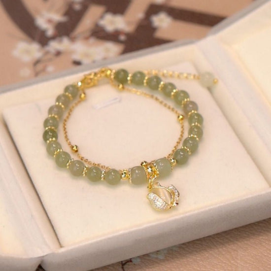 Women's Fashion Simple Tulip Double-layer Bracelet $12.60 Dana Fashion Color: Green Women's Accessories Product information: Treatment Process: Electroplating Color: double-layer Tulip Hetian jade bracelet Applicable population: Female Style: Women's Mate