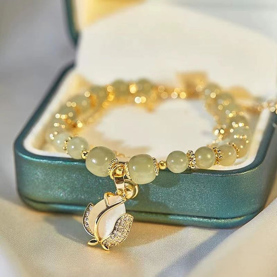 Women's Fashion Simple Tulip Double-layer Bracelet $12.60 Dana Fashion Color: Green Women's Accessories Product information: Treatment Process: Electroplating Color: double-layer Tulip Hetian jade bracelet Applicable population: Female Style: Women's Mate