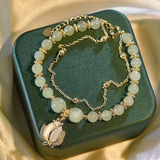 Women's Fashion Simple Tulip Double-layer Bracelet $12.60 Dana Fashion Color: Green Women's Accessories Product information: Treatment Process: Electroplating Color: double-layer Tulip Hetian jade bracelet Applicable population: Female Style: Women's Mate