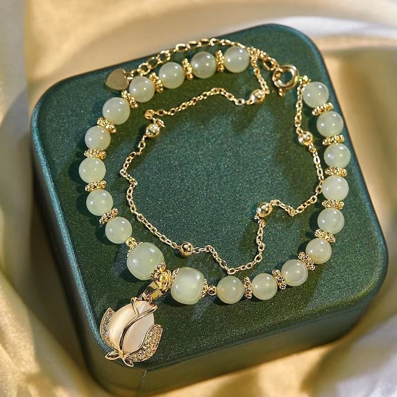 Women's Fashion Simple Tulip Double-layer Bracelet $12.60 Dana Fashion Color: Green Women's Accessories Product information: Treatment Process: Electroplating Color: double-layer Tulip Hetian jade bracelet Applicable population: Female Style: Women's Mate