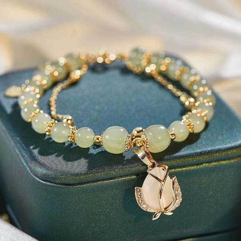 Women's Fashion Simple Tulip Double-layer Bracelet $12.60 Dana Fashion Color: Green Women's Accessories Product information: Treatment Process: Electroplating Color: double-layer Tulip Hetian jade bracelet Applicable population: Female Style: Women's Mate