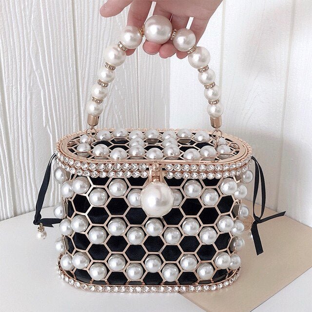 Women's Ins Bucket Bag Versatile Diagonal Pearl Bag $120.00 Dana Fashion Color: Black Women's Bags Product Information: Color: Apricot inner bag style, black inner bag style Style: Fashion Article No.: 3602 Material: PU Cortical characteristics: pu Luggag