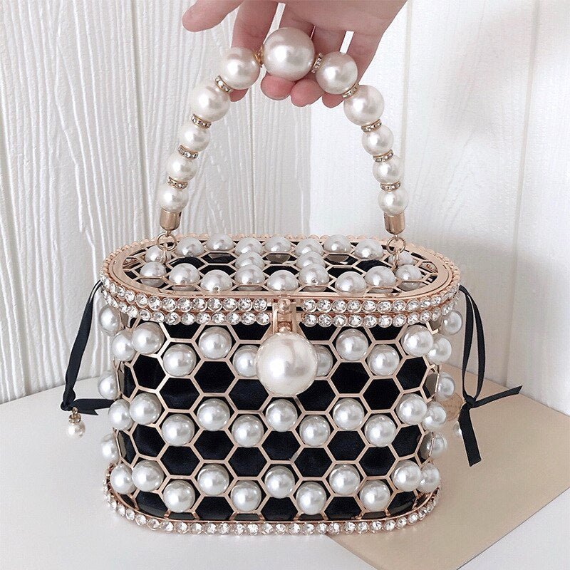 Women's Ins Bucket Bag Versatile Diagonal Pearl Bag $120.00 Dana Fashion Color: Apricot Women's Bags Product Information: Color: Apricot inner bag style, black inner bag style Style: Fashion Article No.: 3602 Material: PU Cortical characteristics: pu Lugg