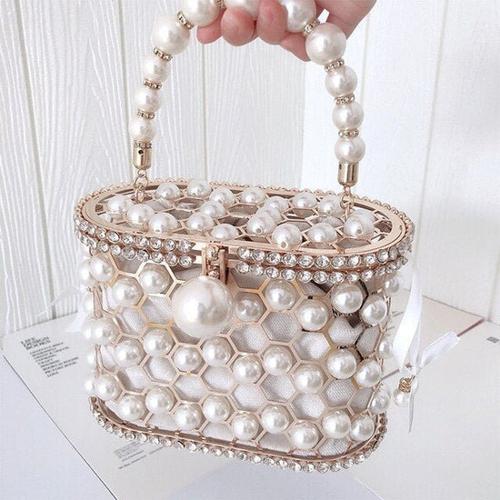 Women's Ins Bucket Bag Versatile Diagonal Pearl Bag $120.00 Dana Fashion Color: Apricot Women's Bags Product Information: Color: Apricot inner bag style, black inner bag style Style: Fashion Article No.: 3602 Material: PU Cortical characteristics: pu Lugg