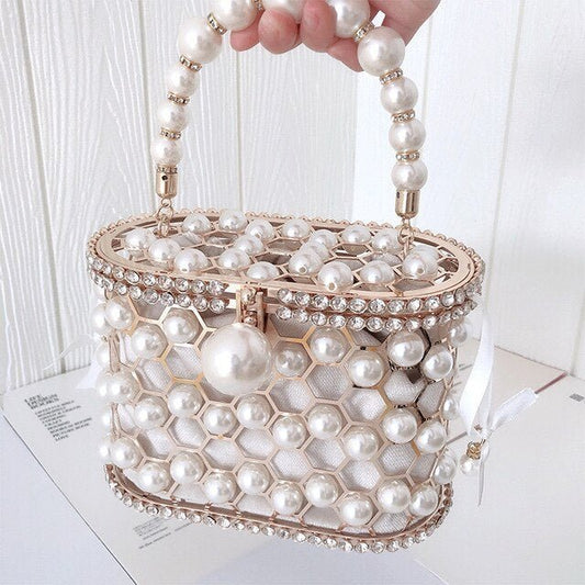 Women's Ins Bucket Bag Versatile Diagonal Pearl Bag $120.00 Dana Fashion Color: Apricot Women's Bags Product Information: Color: Apricot inner bag style, black inner bag style Style: Fashion Article No.: 3602 Material: PU Cortical characteristics: pu Lugg