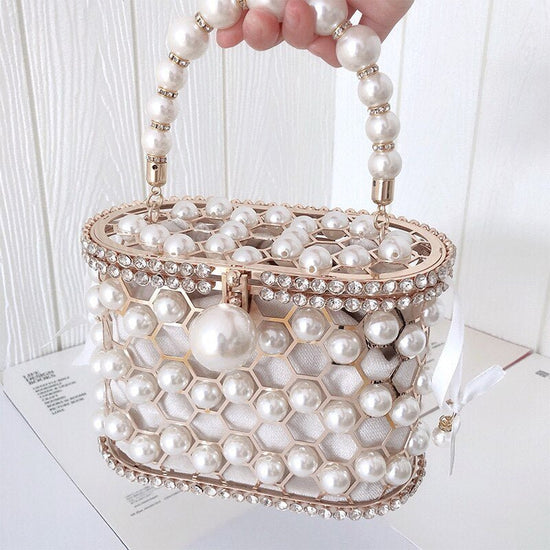 Women's Ins Bucket Bag Versatile Diagonal Pearl Bag $120.00 Dana Fashion Color: Apricot Women's Bags Product Information: Color: Apricot inner bag style, black inner bag style Style: Fashion Article No.: 3602 Material: PU Cortical characteristics: pu Lugg