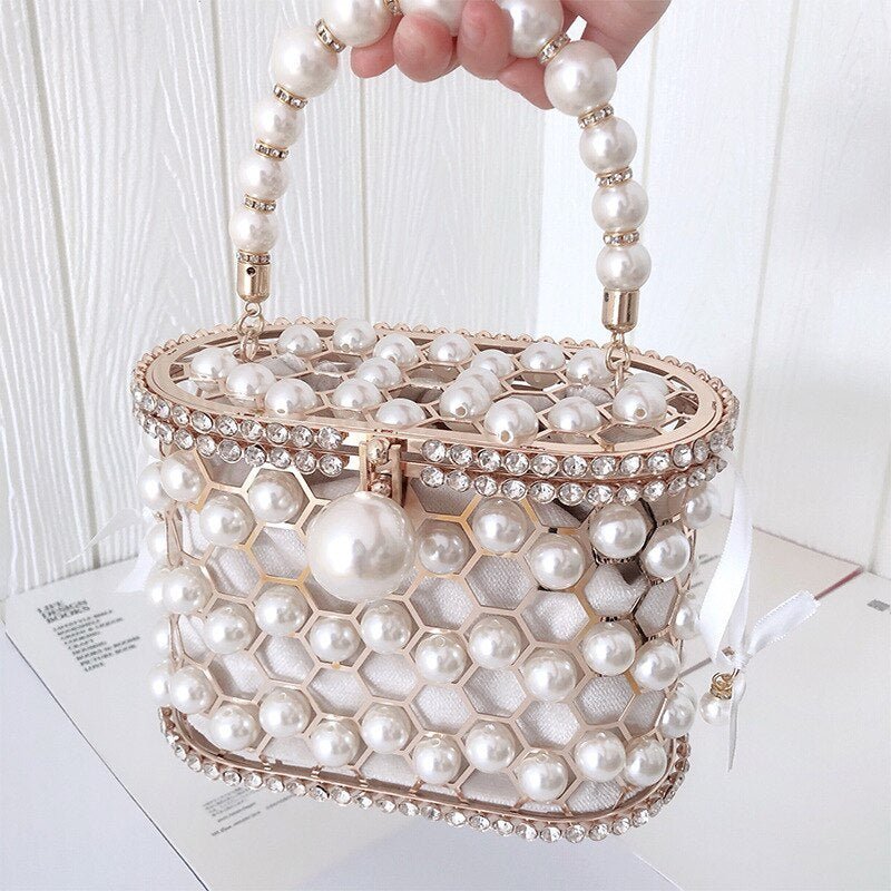Women's Ins Bucket Bag Versatile Diagonal Pearl Bag $120.00 Dana Fashion Color: Apricot Women's Bags Product Information: Color: Apricot inner bag style, black inner bag style Style: Fashion Article No.: 3602 Material: PU Cortical characteristics: pu Lugg