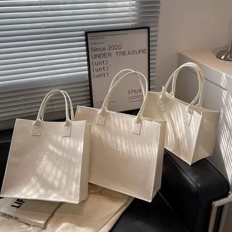 Women's Ins Large Capacity Travel Good-looking All-match Felt Portable Gift Bag $15.00 Dana Fashion Color: Healing white Specification Size: L Women's Bags Product information: Composition and content: Chemical Fiber Another name: Letter felt handbag Prod