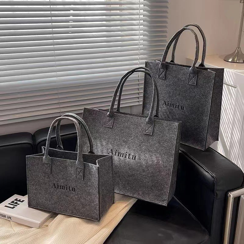 Women's Ins Large Capacity Travel Good-looking All-match Felt Portable Gift Bag $15.00 Dana Fashion Color: High class grey Specification Size: L Women's Bags Product information: Composition and content: Chemical Fiber Another name: Letter felt handbag Pr