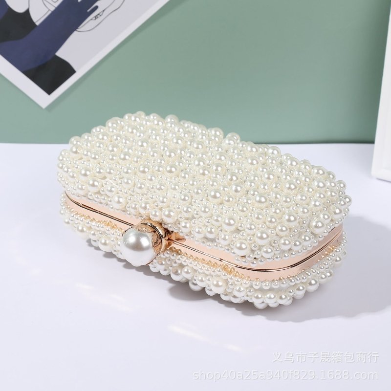 Women's Pearl Dinner Bag Soft Surface Lock Clutch $60.00 Dana Fashion Color: Beige Women's Bags Product information: Fabric texture: Satin Lining texture: Satin Color: white (pearl buckle), Beige Hardness: medium and soft Material: pc abs Suitcase shape: