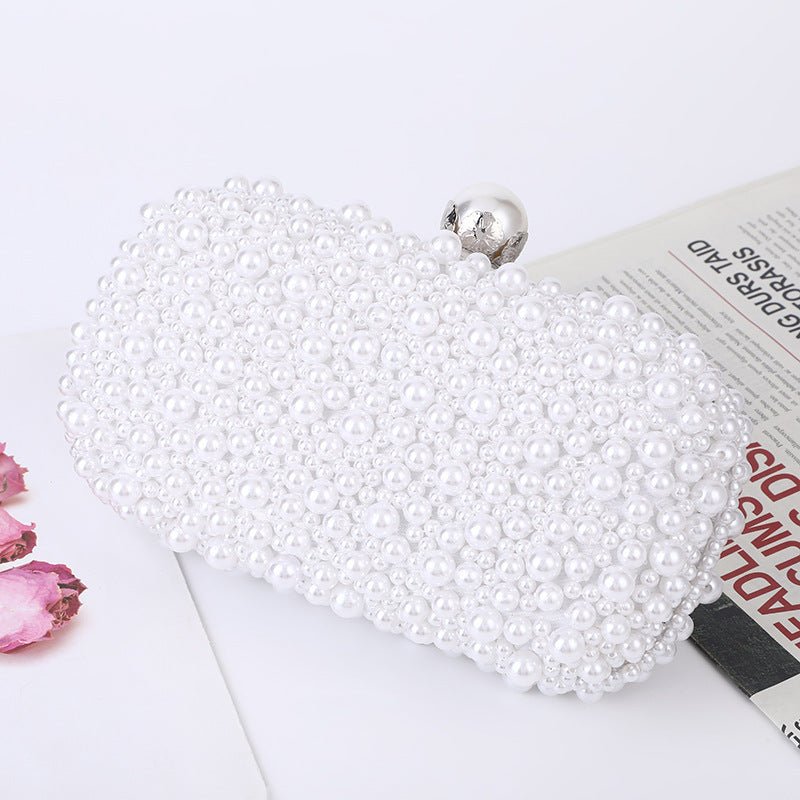 Women's Pearl Dinner Bag Soft Surface Lock Clutch $60.00 Dana Fashion Color: White Pearl Buckle Women's Bags Product information: Fabric texture: Satin Lining texture: Satin Color: white (pearl buckle), Beige Hardness: medium and soft Material: pc abs Sui