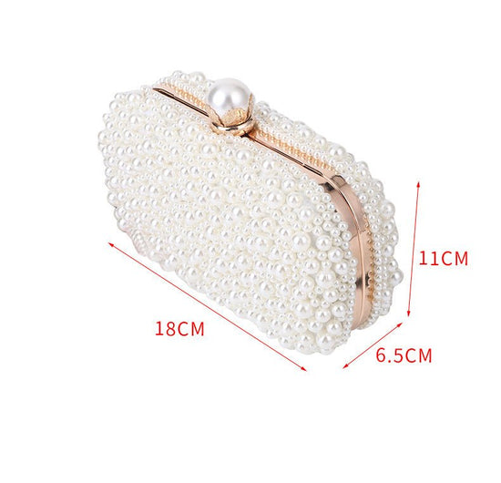 Women's Pearl Dinner Bag Soft Surface Lock Clutch $60.00 Dana Fashion Color: Beige Women's Bags Product information: Fabric texture: Satin Lining texture: Satin Color: white (pearl buckle), Beige Hardness: medium and soft Material: pc abs Suitcase shape: