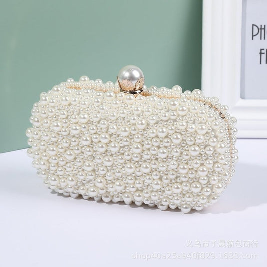 Women's Pearl Dinner Bag Soft Surface Lock Clutch $60.00 Dana Fashion Color: Beige Women's Bags Product information: Fabric texture: Satin Lining texture: Satin Color: white (pearl buckle), Beige Hardness: medium and soft Material: pc abs Suitcase shape:
