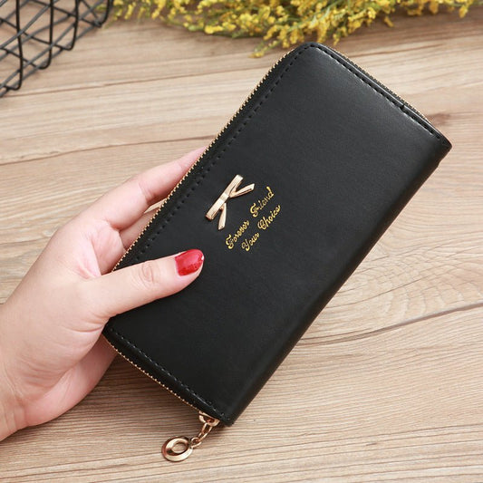 Women's Solid Color Bow Two-layer Wallet $25.00 Dana Fashion Color: Black Women's Bags Product information: Pattern: solid color Color: white, yellow, red, wine red, purple, green, dark blue, black, pink, watermelon red, Rose Red, Tea Green, sapphire blue