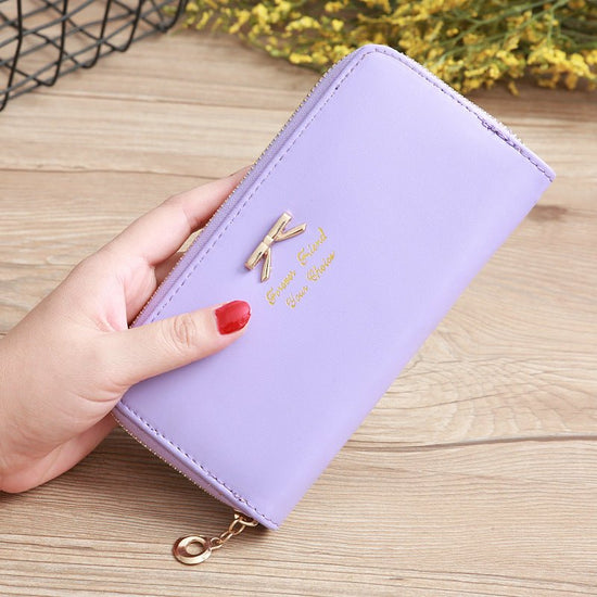 Women's Solid Color Bow Two-layer Wallet $25.00 Dana Fashion Color: Purple Women's Bags Product information: Pattern: solid color Color: white, yellow, red, wine red, purple, green, dark blue, black, pink, watermelon red, Rose Red, Tea Green, sapphire blu