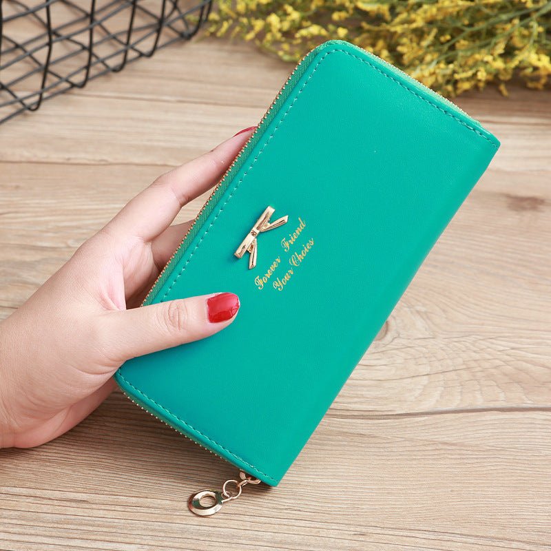 Women's Solid Color Bow Two-layer Wallet $25.00 Dana Fashion Color: Green Women's Bags Product information: Pattern: solid color Color: white, yellow, red, wine red, purple, green, dark blue, black, pink, watermelon red, Rose Red, Tea Green, sapphire blue