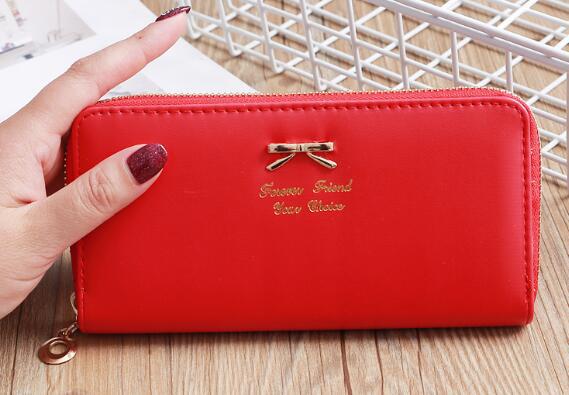 Women's Solid Color Bow Two-layer Wallet $25.00 Dana Fashion Color: Red Women's Bags Product information: Pattern: solid color Color: white, yellow, red, wine red, purple, green, dark blue, black, pink, watermelon red, Rose Red, Tea Green, sapphire blue,