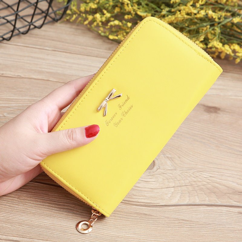 Women's Solid Color Bow Two-layer Wallet $25.00 Dana Fashion Color: Yellow Women's Bags Product information: Pattern: solid color Color: white, yellow, red, wine red, purple, green, dark blue, black, pink, watermelon red, Rose Red, Tea Green, sapphire blu