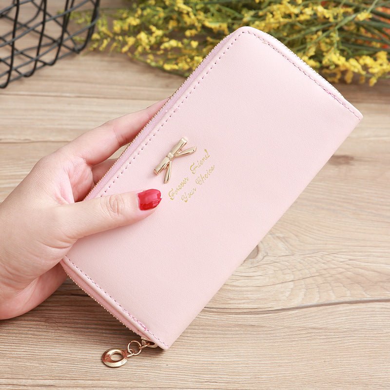 Women's Solid Color Bow Two-layer Wallet $25.00 Dana Fashion Color: Pink Women's Bags Product information: Pattern: solid color Color: white, yellow, red, wine red, purple, green, dark blue, black, pink, watermelon red, Rose Red, Tea Green, sapphire blue,