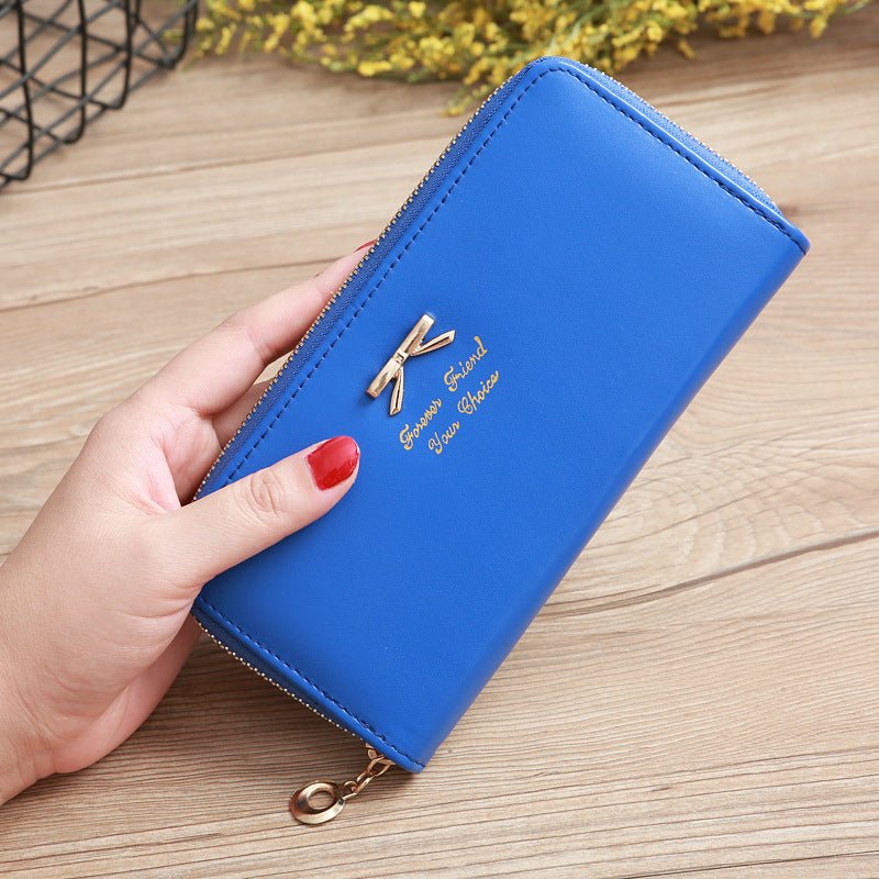 Women's Solid Color Bow Two-layer Wallet $25.00 Dana Fashion Color: Sapphire Blue Women's Bags Product information: Pattern: solid color Color: white, yellow, red, wine red, purple, green, dark blue, black, pink, watermelon red, Rose Red, Tea Green, sapph