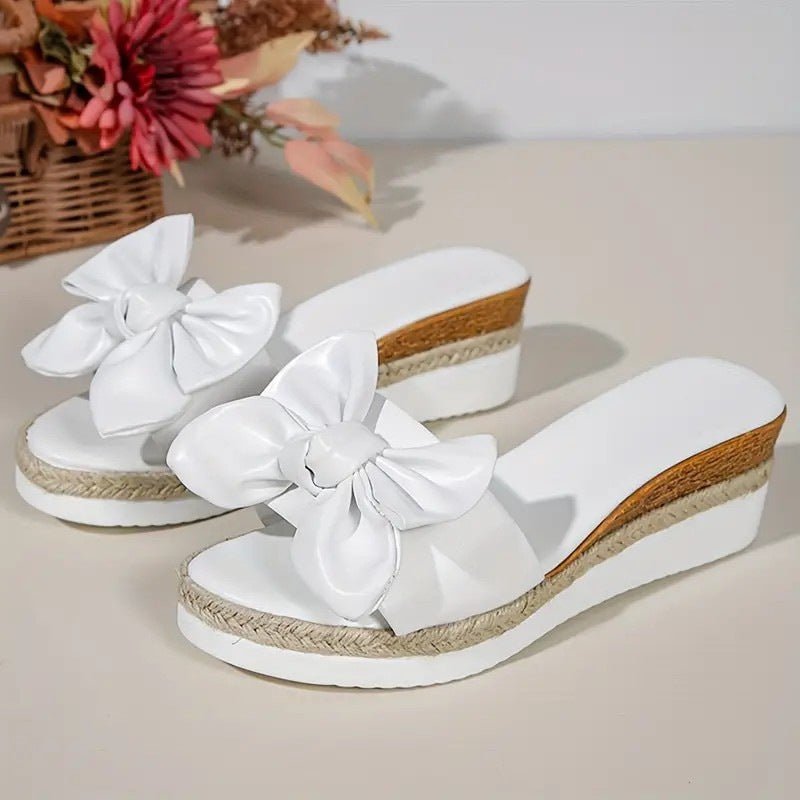 Women's Wedge Bow Slippers $37.50 Dana Fashion Color: White Size: 36 Women's shoes Product information: Lining material: Leather Toe holder shape: Fish Mouth Color: white, black Shoe Upper material: artificial PU Size: 36,37,38,39,40,41,42 Sole material: