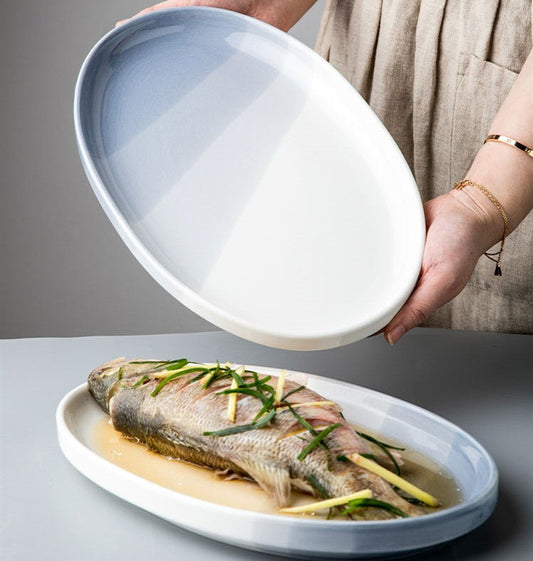 Youci Creative Ceramic Fish Plate Nordic $98.48 Dana Fashion style: 12.5inch fish pan Dana's Kitchen Product information : Material: Porcelain Style: Nordic style Shape: oval Popular elements: Ink style Color classification: Wuhai series-12.5 inch fish pl