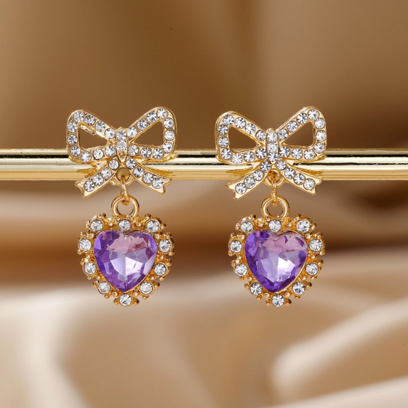 Zinc Alloy Bow Heart Shape With Diamond Earrings $9.84 Dana Fashion Color: Purple Love Women's Accessories Product information: Color: blue loving heart, pink love, Red Love, purple love, Rose Red Love Material: zinc alloy Shape: heart-shaped, Bow Packing