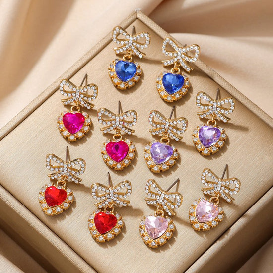 Zinc Alloy Bow Heart Shape With Diamond Earrings $9.84 Dana Fashion Color: Blue Loving Heart Women's Accessories Product information: Color: blue loving heart, pink love, Red Love, purple love, Rose Red Love Material: zinc alloy Shape: heart-shaped, Bow P