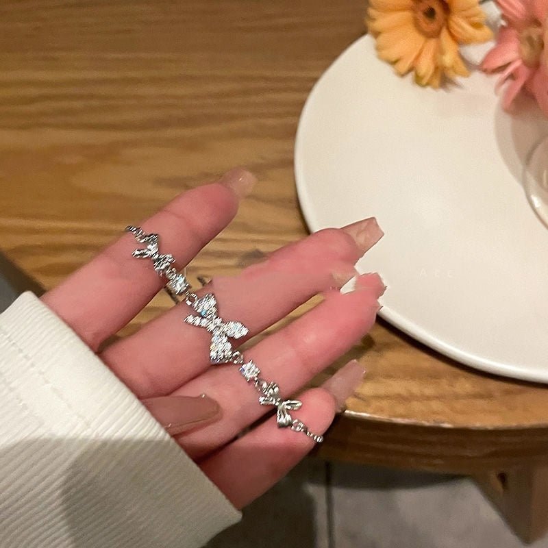 Zircon Bow Pull Adjustable Bracelet $7.50 Dana Fashion Color: Silver Bracelet Women's Accessories Product information: Color: zircon butterfly silver bracelet, 9*9 packing box Applicable people: women Style: Women's Material: Alloy Shape: Bow Popular elem