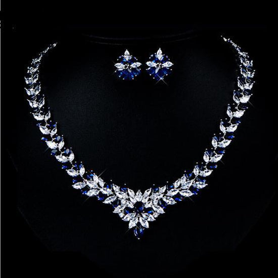Zircon Flower Stud Necklace Set $49.50 Dana Fashion Color: Blue Women's Accessories Style: Korean Material: Copper Processing technology: gem setting Set combination: earrings + items Setting material: gold-plated inlaid artificial gems / semi-precious st