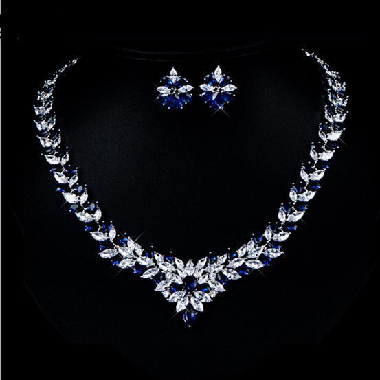 Zircon Flower Stud Necklace Set $49.50 Dana Fashion Color: Blue Women's Accessories Style: Korean Material: Copper Processing technology: gem setting Set combination: earrings + items Setting material: gold-plated inlaid artificial gems / semi-precious st