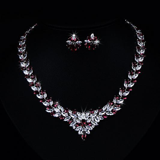 Zircon Flower Stud Necklace Set $49.50 Dana Fashion Color: Red Women's Accessories Style: Korean Material: Copper Processing technology: gem setting Set combination: earrings + items Setting material: gold-plated inlaid artificial gems / semi-precious sto